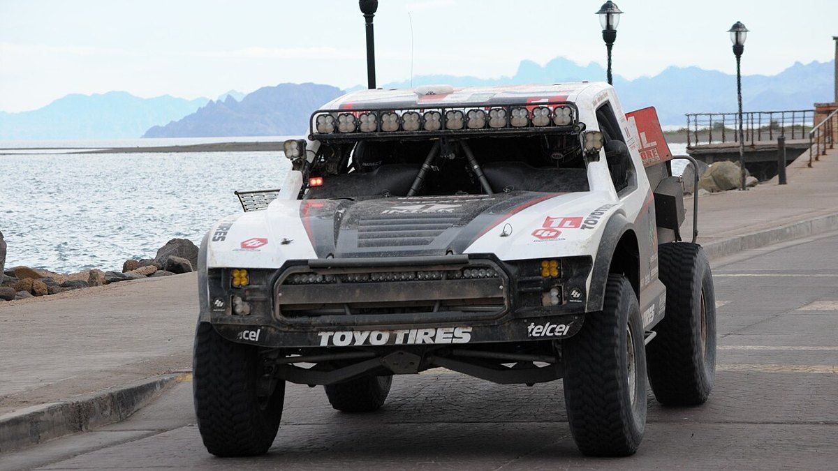 A SCORE trophy truck on the Ensenada malecon before the Baja 1000