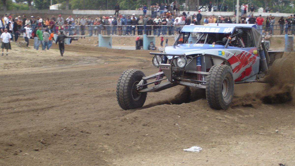SCORE Baja 500: Race Guide & Mexican Insurance 2 An off-road race car competing in the SCORE Baja 500 in the desert